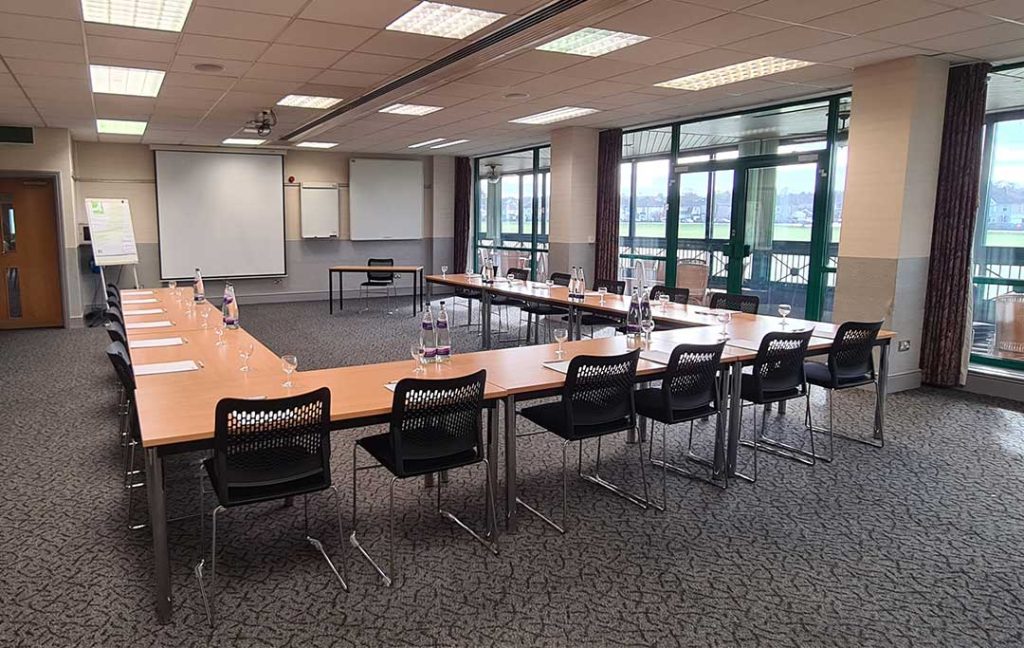 Conference Room 1 with tables forming an 'U' shape