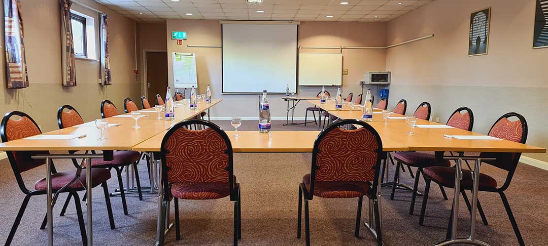 Conference Room 4 with tables forming an 'U' shape