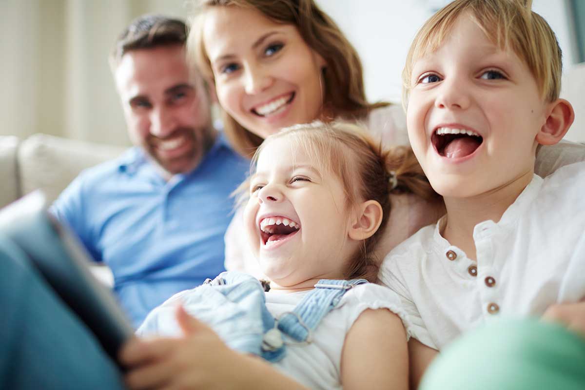 Family looking at the camera and laughing