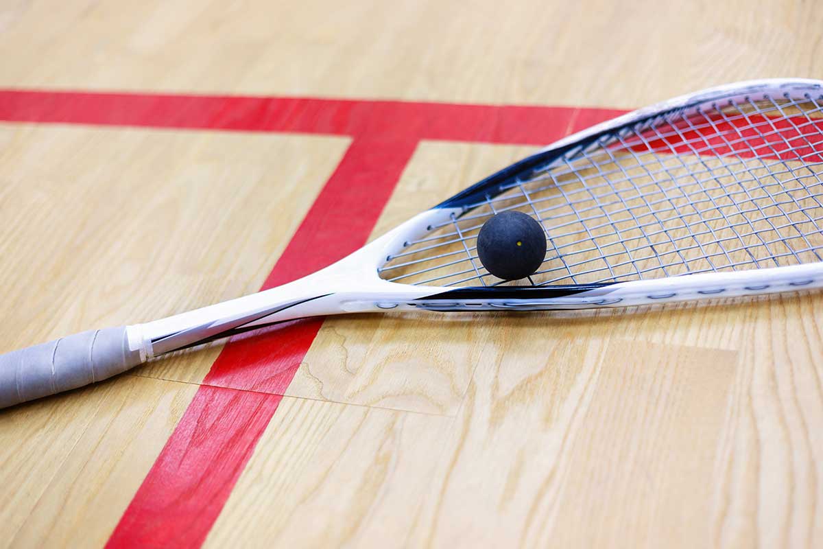 Squash racket with a competitive ball on it
